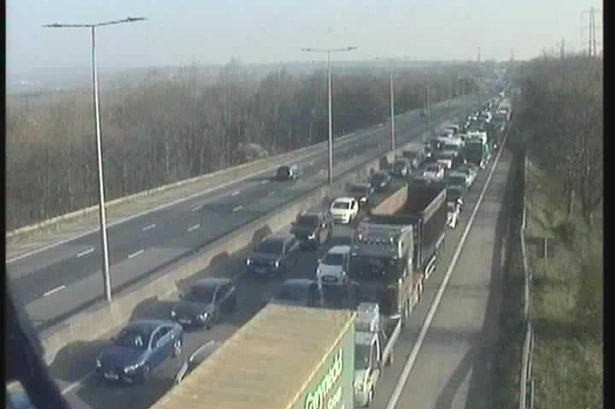 M5 car fire live as all traffic held on motorway causing huge queues near Birmingham