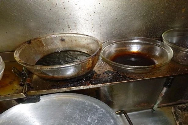 Inside 'dirty' takeaway where mice left poo and there was no running hot water
