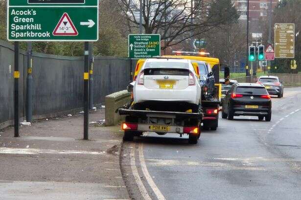 Main Birmingham road closed for hours as two-car crash sees woman rushed to hospital