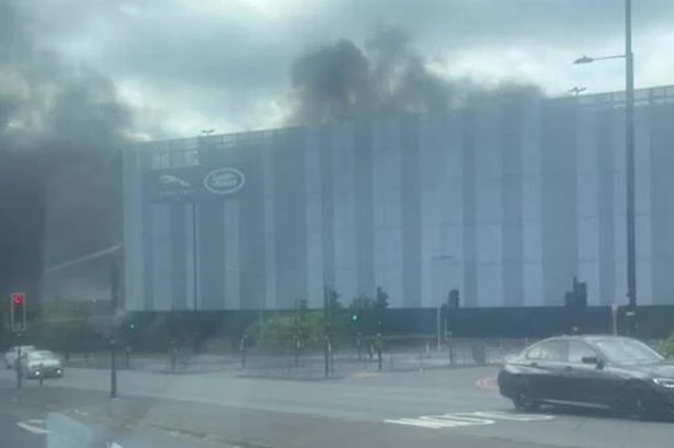 Jaguar Land Rover fire live as emergency services rush to scene