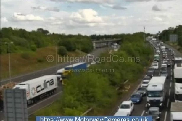 Rush hour delays live as vehicle burst into flames on the M42