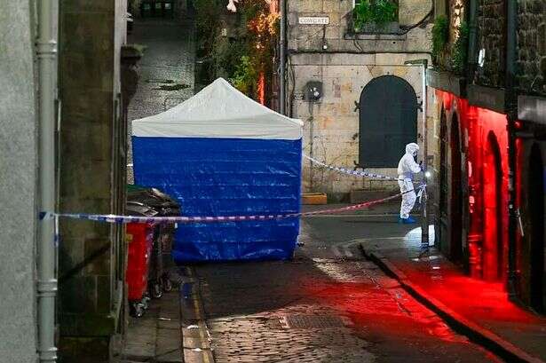 Police officers rush to crash scene after 'severed head found in street'