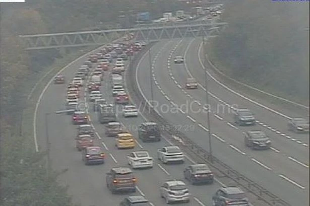 M6 delays at Spaghetti Junction after four cars crash and fuel spillage