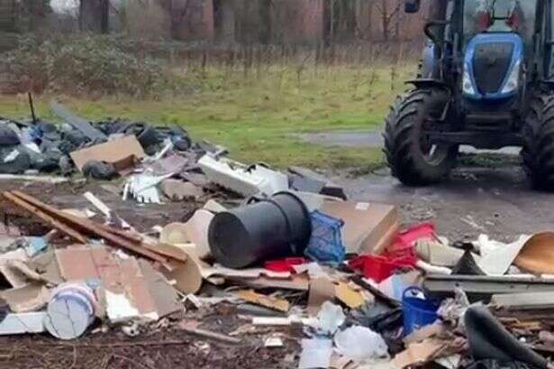 Diggers clear fly-tipped field seen by thousands of commuters