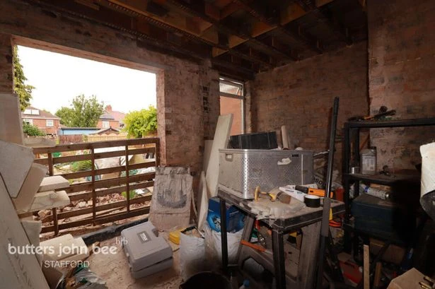Inside Midland house for sale with no back to the property