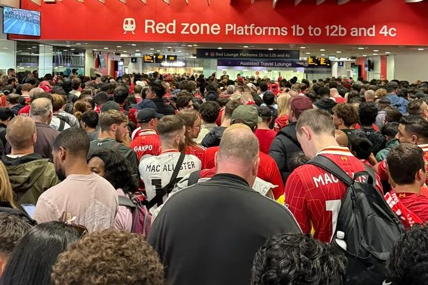 Hundreds of Liverpool FC fans fill Birmingham New Street in race to make victory parade
