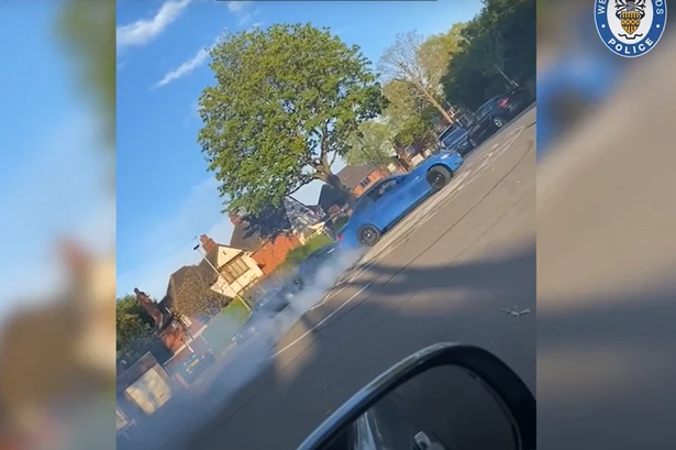 Moment brazen gang film themselves doing wheelies in stolen car