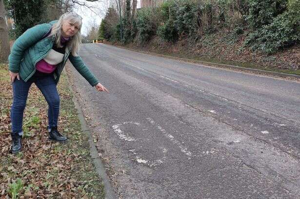 Midland road with faded 'slow' marking labelled 'accident waiting to happen'