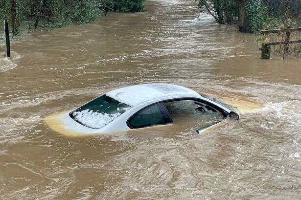 Car submerged in Birmingham flood water after heaving rain overnight