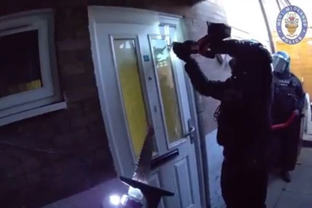 Police smash their way into homes of suspected car thieves