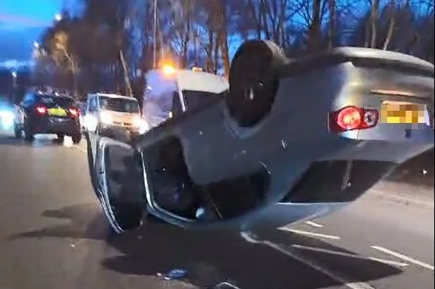 Car flips on busy Walsall road with one taken to hospital