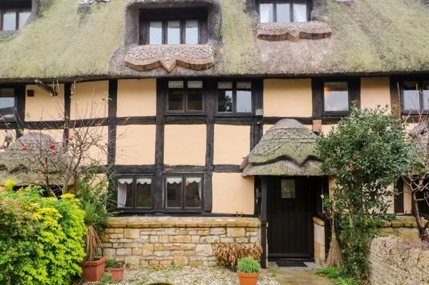 The 'fairy tale' Cotswold thatched cottage which has an 'upside down' surprise