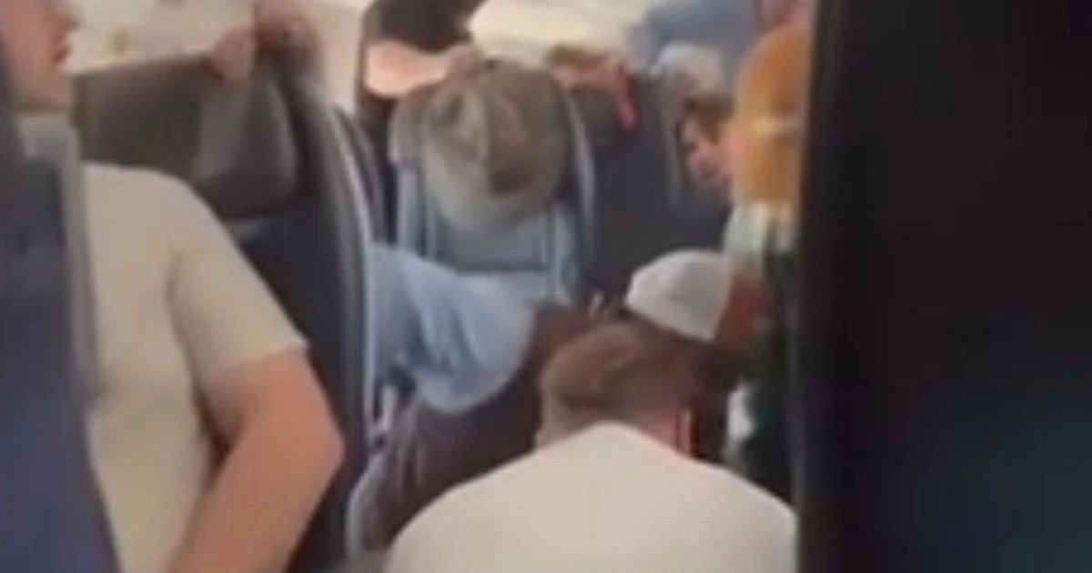 Mid-air horror as passengers tackle man trying to open plane door before duct-taping his legsAmerican Airlines